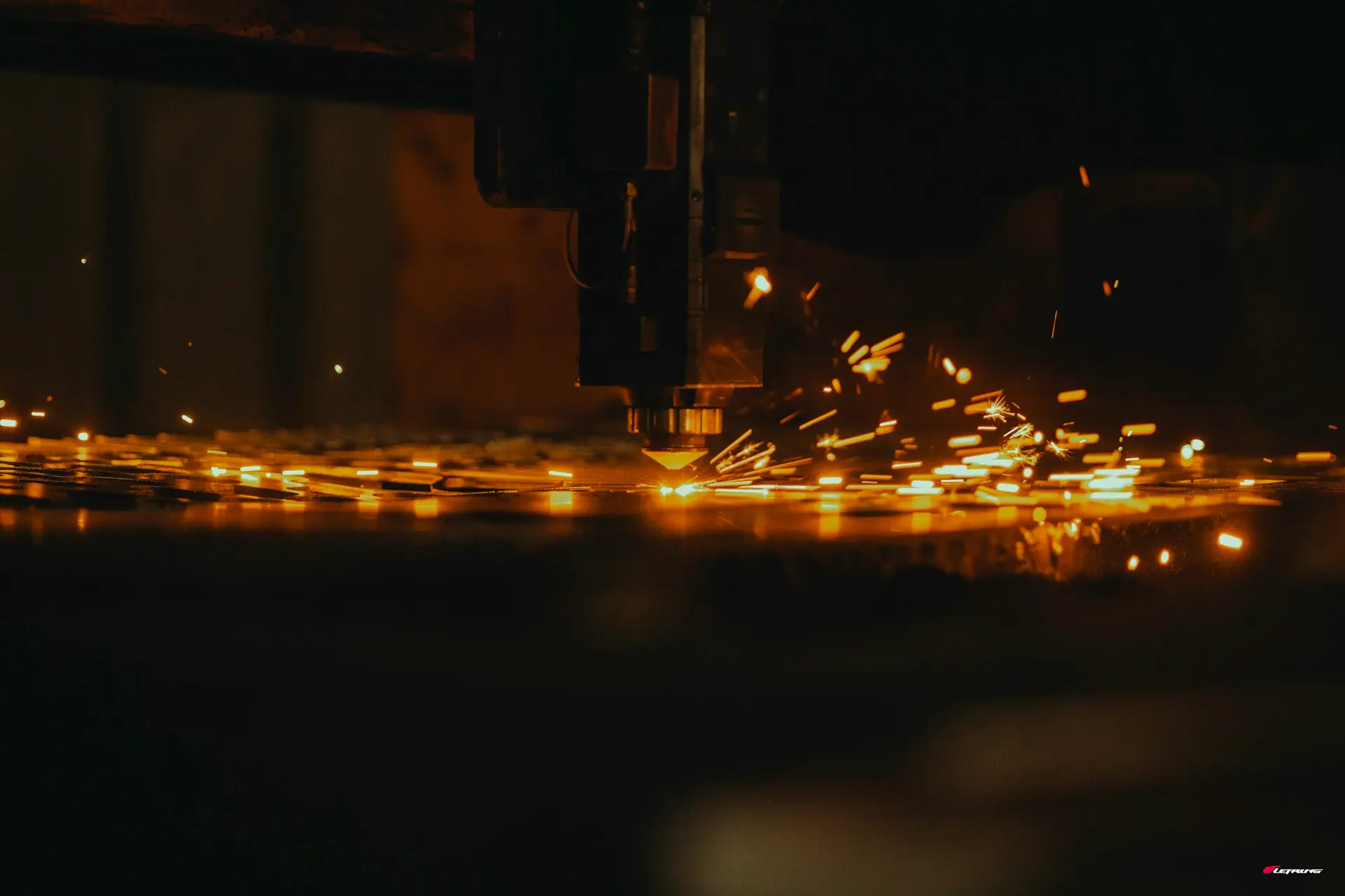 a close up of a machine cutting a piece of metal